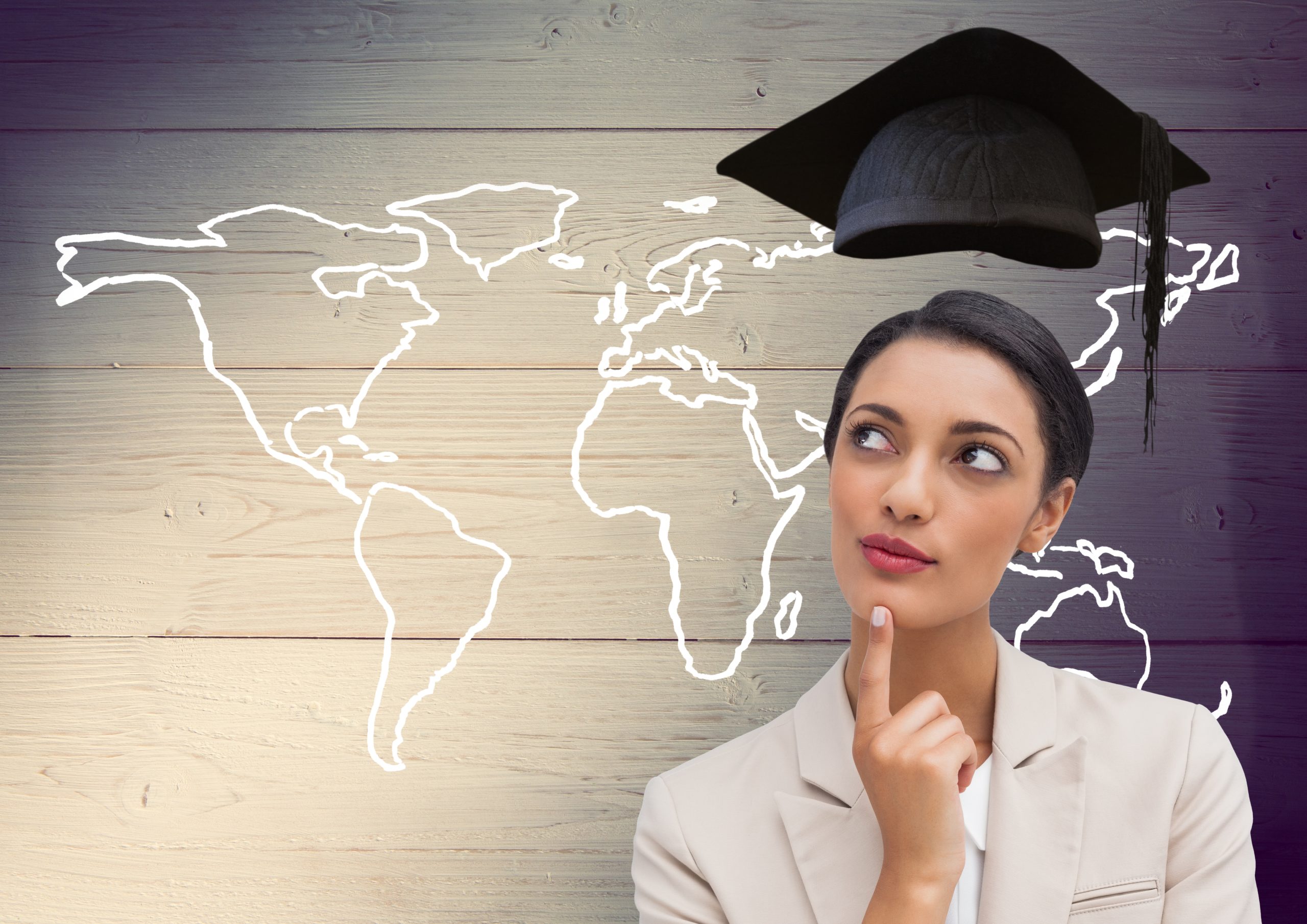 A girl standing along with classy black wooden world map, behind her